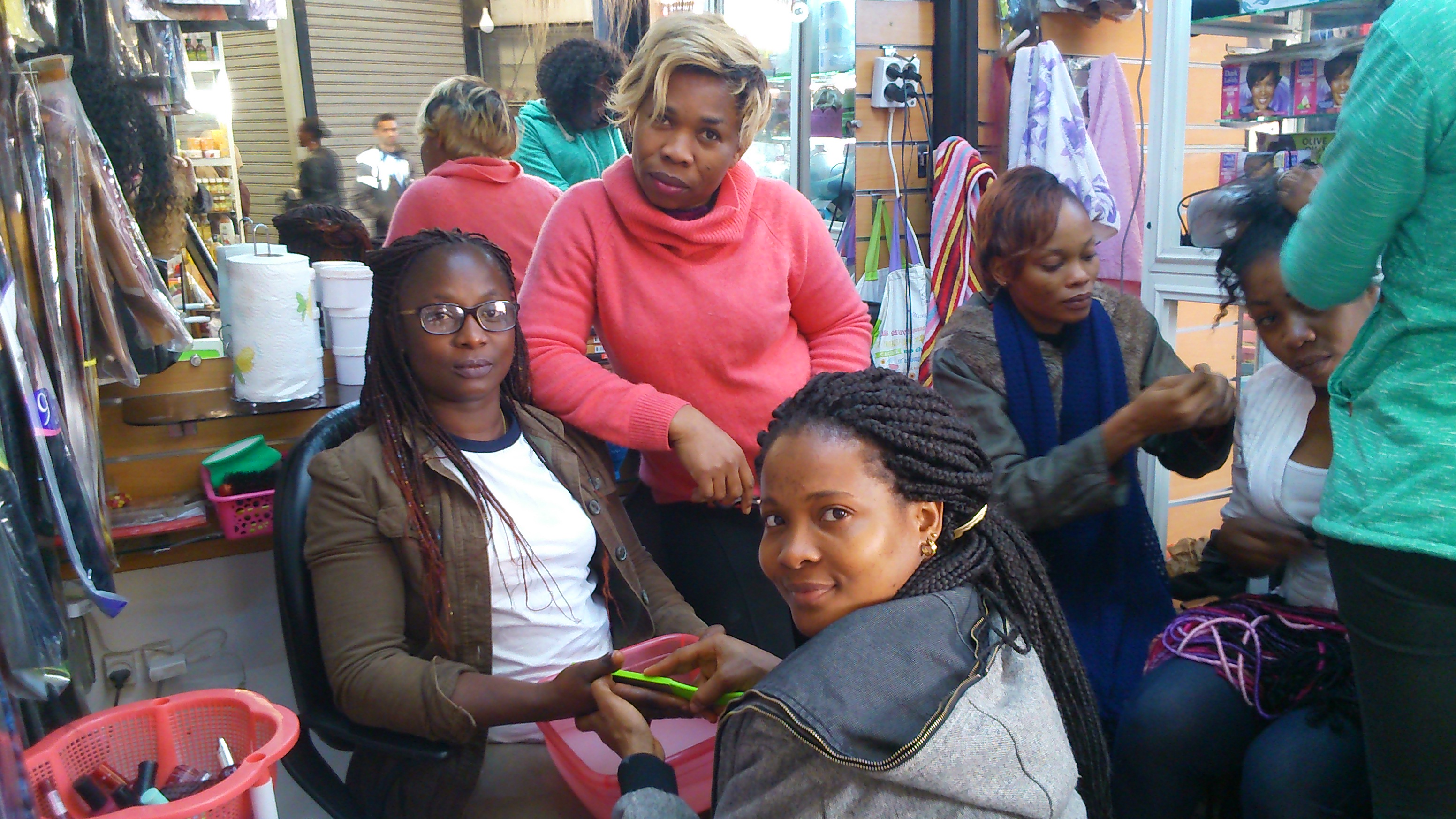 Suzanne Niamke, left, in her beauty salon 2